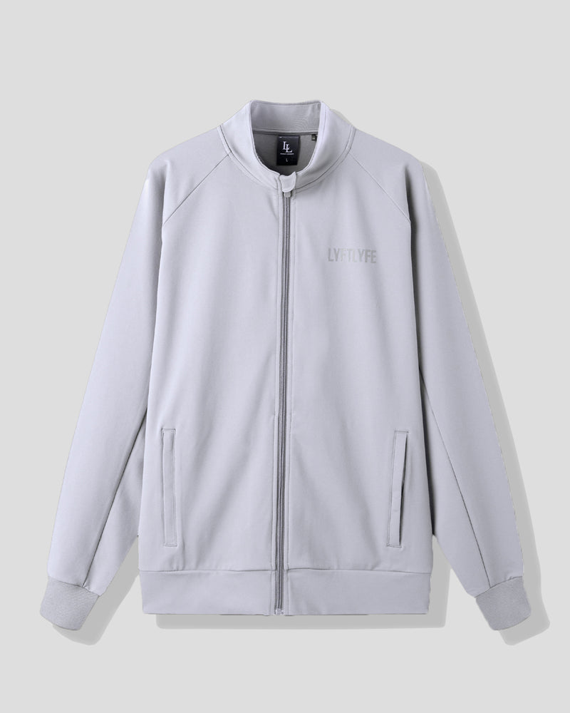 Light gray jacket with a brand logo on a light gray background