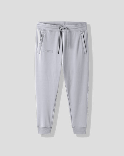 Light gray sweatpants with a brand logo on a white background