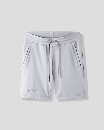 Light gray shorts with a drawstring on a light gray background
