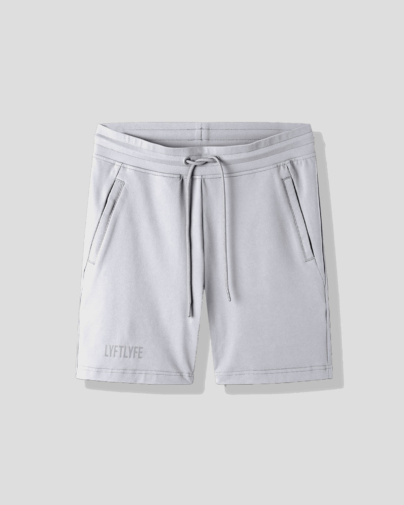 Light gray shorts with a drawstring on a light gray background