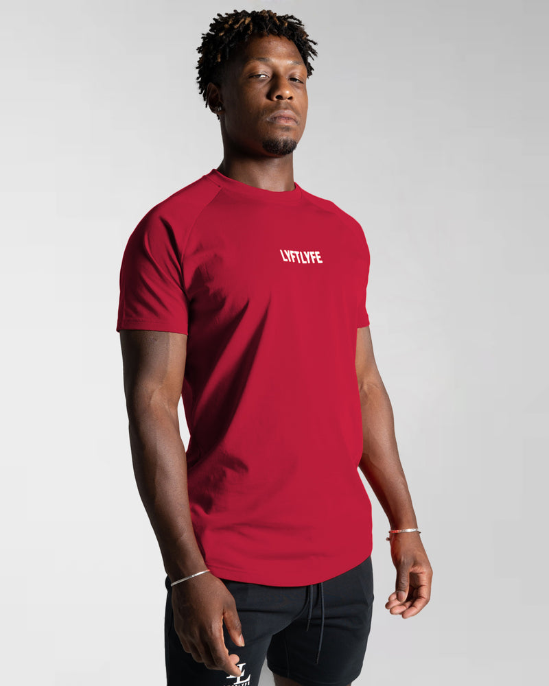 Front view of Men’s Contour T-Shirt in red, crafted with moisture-wicking fabric and a fitted cut for everyday movement.