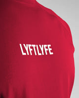 Detailed shot of the white LYFTLYFE logo on the red Contour Tee.