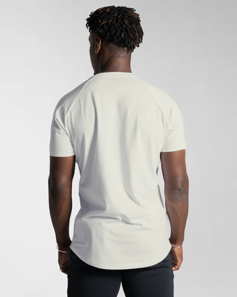 Men’s Contour T-Shirt in off-white, crafted with moisture-wicking fabric and a fitted cut for everyday movement.