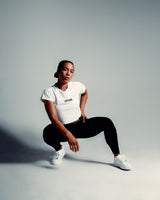 Perfectly cropped white Drill Women’s Tee, featuring a soft crew neckline and breathable moisture-wicking cotton blend.