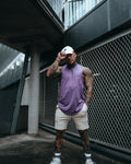 Men’s sleeveless tank top in purple, highlighting lightweight, wrinkle-resistant performance fabric. 