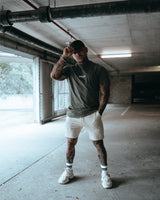 Contour Men’s T-Shirt in green, showing its fitted cut, wrinkle-resistant fabric, and smooth stitching details.