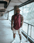 Men’s Dominance Cut Sleeve in dark wine color, highlighting a lightweight stretch material for unrestricted movement.