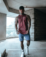 Front view of Men’s Dominance Cut Sleeve in dark wine color, highlighting a lightweight stretch material for unrestricted movement.
