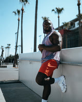 Side view of the Men’s Dominance Sleeveless Hoodie in purple, showcasing its breathable fabric and ergonomic fit with a relaxed hood