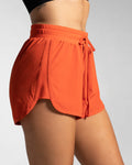Right side view of cherry red LYFTLYFE shorts showcasing motion-ready design.
