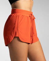Right side view of cherry red LYFTLYFE shorts showcasing motion-ready design.