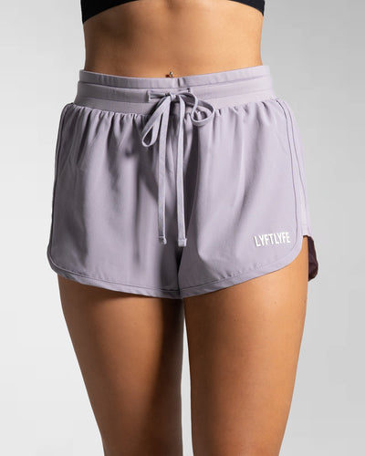High-waisted purple women's HIIT shorts with front drawstrings and LYFTLYFE logo.