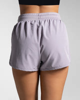 Back view of Lightweight purple workout shorts designed for breathability and comfort.