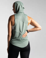 Back view of Women’s Dominance Sleeveless Hoodie in green, featuring a lightweight hood and breathable performance fabric.