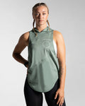 Women’s Dominance Sleeveless Hoodie in green, featuring a lightweight hood and breathable performance fabric.