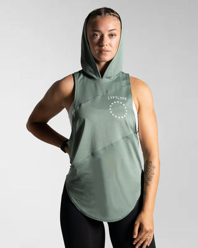 Front view of Women’s Dominance Sleeveless Hoodie in green, featuring a lightweight hood and breathable performance fabric.