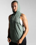 Left side view of Women’s Dominance Sleeveless Hoodie in green, featuring a lightweight hood and breathable performance fabric.
