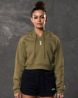 Front view of women’s cropped hoodie in pine green with 3D Lyftlyfe logo and tonal drawstrings.