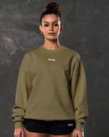Women’s fleece crewneck in green with ribbed hems, a clean oversized design, and bold 3D Lyftlyfe branding on the chest.