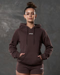 Brown hoodie for women styled with matching brown gym shorts.