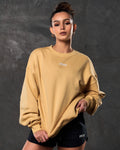 Women’s ultra-soft yellow crewneck sweater with lightweight fleece fabric, ribbed details, and Lyftlyfe logo.
