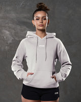 Women's white sand full-length hoodie with center LYFTLYFE logo and drawstrings.