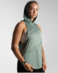 Right side view of Women’s Dominance Sleeveless Hoodie in green, featuring a lightweight hood and breathable performance fabric.
