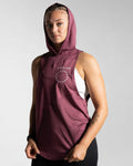Left side view of Women’s Dominance Hoodie in prune, highlighting a scoop hem, soft stretch fabric, and ergonomic fit.