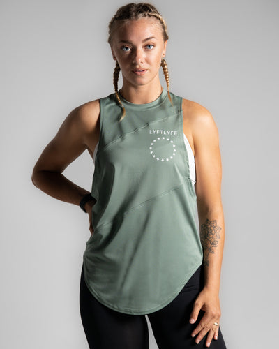 Women’s Dominance Cut Sleeve tank top in green, featuring lightweight tri-blend fabric with antibacterial and anti-odor technology.