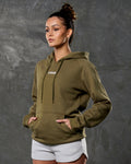 Left side view of green hoodie showing kangaroo pocket and tonal drawstrings.