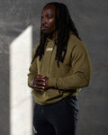 Men's green fleece hoodie right side view with relaxed fit and ribbed cuffs.