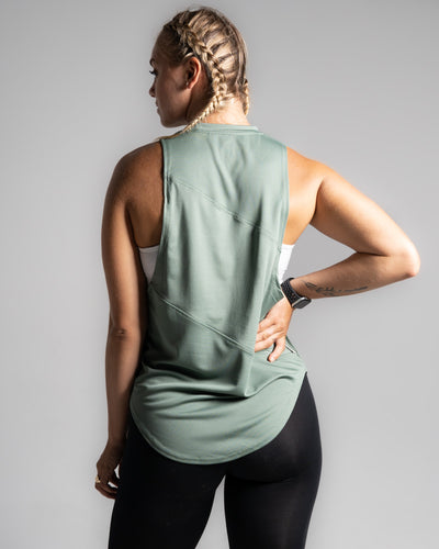 Women’s Dominance Cut Sleeve tank top in green, featuring lightweight tri-blend fabric with antibacterial and anti-odor technology.