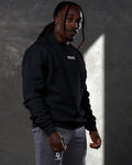 Side profile of men’s black oversized crewneck with ultra-soft fleece, ribbed cuffs, and a relaxed, comfortable fit.