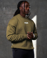 Right Side view of men’s Adapt Crew in green with relaxed fit, ribbed detailing, and lightweight fleece material for all-day wear.