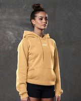 Right side view of yellow hoodie showing kangaroo pocket and tonal drawstrings.
