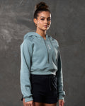 Right side profile of Elite cropped hoodie in slate color, showing relaxed fit and ribbed hem.