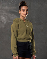 Right side profile of Elite cropped hoodie in green showing relaxed fit and ribbed hem.