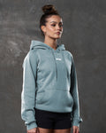 Right side view of slate hoodie showing kangaroo pocket and tonal drawstrings.