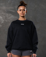 Women’s oversized black crewneck sweater with ultra-plush fleece, 3D rubberized Lyftlyfe logo, and ribbed cuffs and hem.