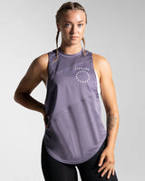 Women’s Dominance Cut Sleeve in purple, showcasing wrinkle-resistant, lightweight fabric for gym wear and a white LYFTLYFE logo on the left chest. 
