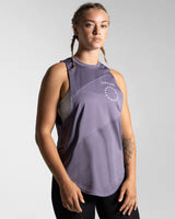 Right side view of Women’s Dominance Cut Sleeve in purple, showcasing wrinkle-resistant, lightweight fabric for gym wear.