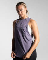 Left side view of Women’s Dominance Cut Sleeve in purple, showcasing wrinkle-resistant, lightweight fabric for gym wear.