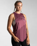 Women’s sleeveless gym tank top in prune shown from the right side, highlighting its lightweight mesh panels and moisture-wicking properties.