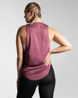 Back view of Women’s Dominance sleeveless tank in prune, crafted with breathable jersey mesh and stretch material for unrestricted movement.