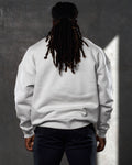 Rear-facing men’s crewneck sweater in sand (off-white), highlighting a relaxed fit and durable cotton-polyester fabric blend.