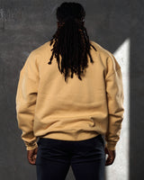 Back view of men’s oversized yellow crewneck sweater with ultra-plush fleece fabric and ribbed hem for a clean finish.