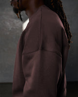 Detailed side view of the Adapt Crew in dark brown, featuring durable stitching and soft-touch cotton-polyester material.