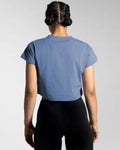 Back view of the blue Drill Women’s Crop T-shirt, showcasing its fitted cut, soft-stretch fabric, and moisture-wicking properties.