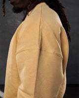 Side view of the men’s yellow Adapt Crew, highlighting clean stitching details and ultra-plush fleece material.