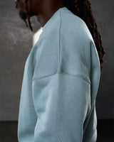 Detailed side view of the Adapt Crew in light blue, featuring durable stitching.